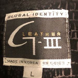 Full length black leather and suede coat.